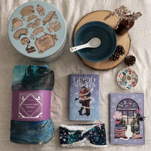 Good Spirits Seasona Box featuring exclusive signed edition and cosy winter gift items.